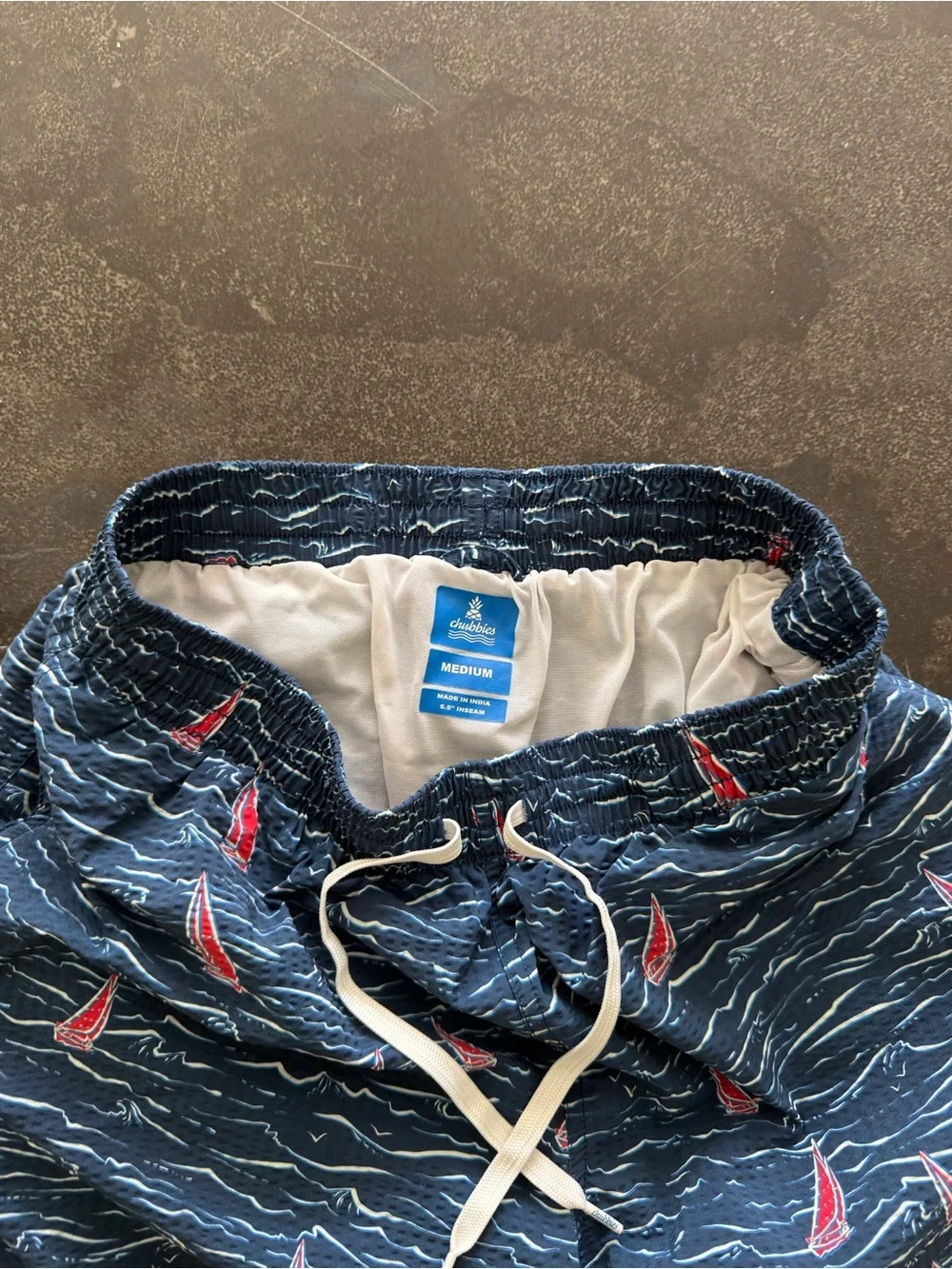 chubbies medium 5.5” inseam Navy Blue Swim Trunks with Red Sailboat Print